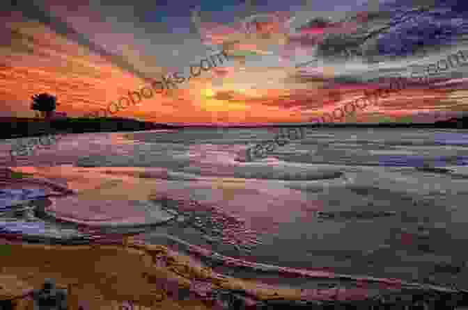 A Breathtaking Panoramic View Of Martha's Vineyard At Sunset, With A Vibrant Palette Of Orange, Pink, And Purple Hues Reflecting Across The Calm Waters. A Vineyard Blizzard (The Vineyard Sunset 12)