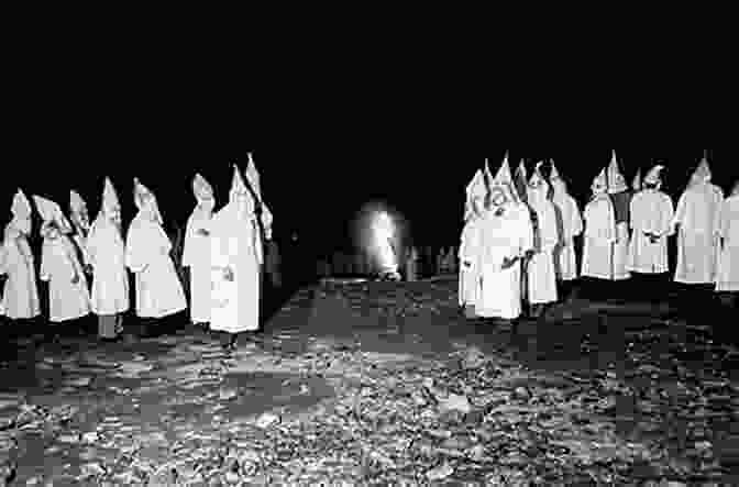 A Group Of People In Ku Klux Klan Robes Standing In Front Of A Burning Cross The Great Oklahoma Swindle: Race Religion And Lies In America S Weirdest State