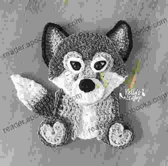 A Stunning Crochet Wolf Applique Adorning A Rustic Wooden Sign, Creating A Captivating Focal Point. Crochet Pattern: Wolf Applique Homeartist Design