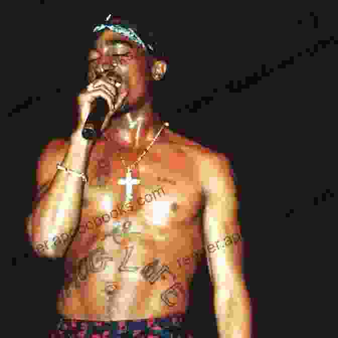 Tupac Shakur Performing On Stage, Wearing A Black Bandana And A Black Vest, Holding A Microphone. How Long Will They Mourn Me?: The Life And Legacy Of Tupac Shakur